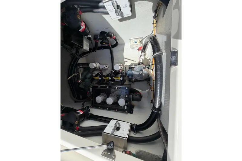 Slide: The Image of 2021 SeaVee 322Z boat engine compartment with wiring and components. - 23