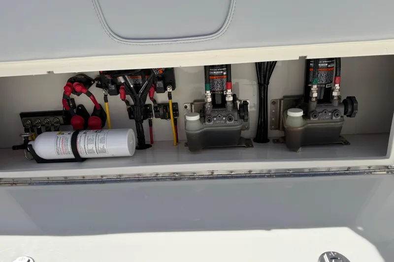 Slide: The Image of 2021 SeaVee 322Z boat hydraulic system and components in storage compartment. - 24