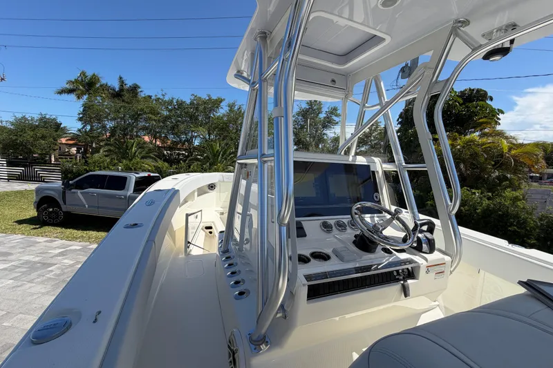 Slide: The Image of 2021 SeaVee 322Z boat cockpit with steering wheel and control panel. - 5