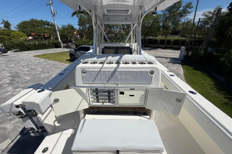 Slide: The Image of 2021 SeaVee 322Z boat interior with open storage compartments and seating. - 7