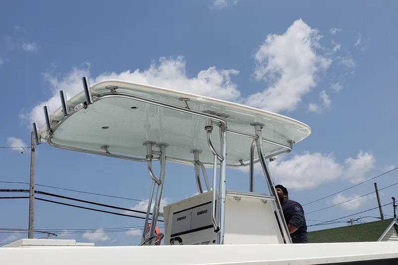 Slide: The Image of 2009 Contender 33 Tournament boat with T-top under a clear blue sky. - 13