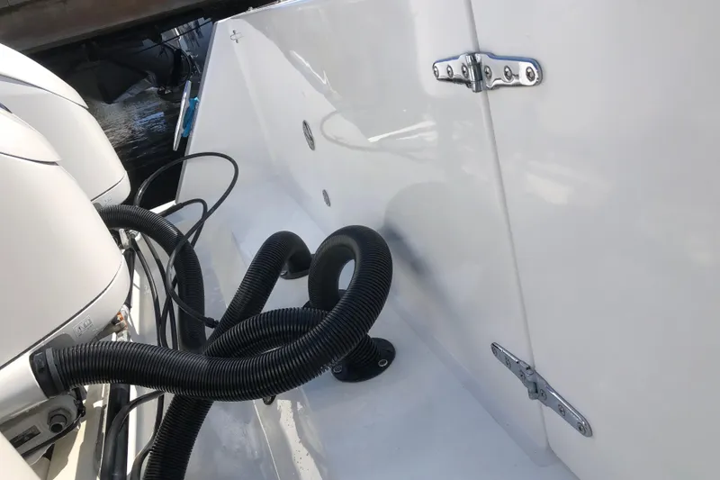 Slide: The Image of 2009 Contender 33 Tournament boat engine area with cables and hinges. - 4