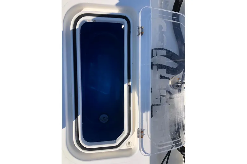 Slide: The Image of Livewell compartment on a 2009 Contender 33 Tournament boat with open transparent lid. - 6