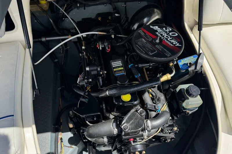 Slide: The Image of Engine compartment of a 2006 Bayliner 195 Bowrider with a 3.0L Mercury engine. - 15