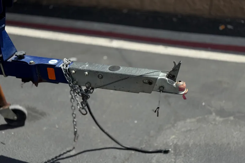 Slide: The Image of Trailer hitch of a 2006 Bayliner 195 Bowrider on pavement. - 27