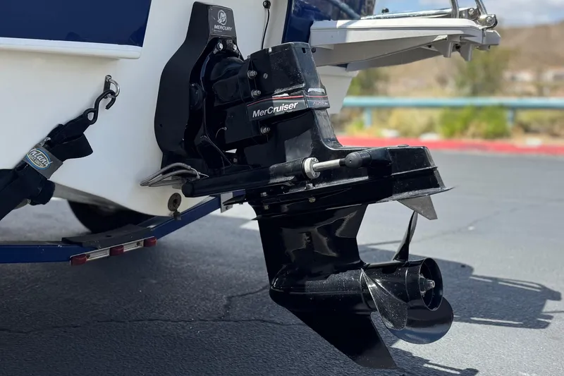 Slide: The Image of 2006 Bayliner 195 Bowrider with MerCruiser engine, detailed view of the outboard motor. - 6