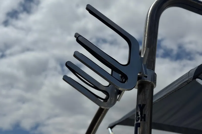 Slide: The Image of Wakeboard rack on a 2006 Bayliner 195 Bowrider against a cloudy sky. - 8