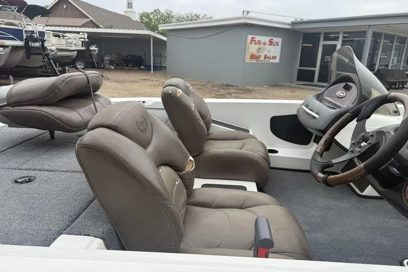 Slide: The Image of 2005 Triton TR-196 boat interior with leather seats and steering wheel. - 11