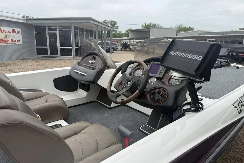 Slide: The Image of 2005 Triton TR-196 boat interior with Humminbird navigation system at dealership. - 12