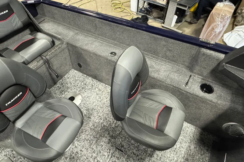 Slide: The Image of Interior of 2026 Tracker Pro Guide V-175 Combo boat with gray and red seating. - 10