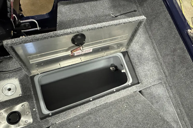 Slide: The Image of Open storage compartment in 2026 Tracker Pro Guide V-175 Combo boat. - 12