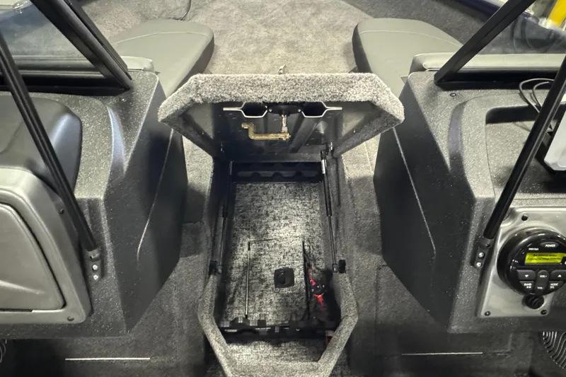 Slide: The Image of 2026 Tracker Pro Guide V-175 Combo boat interior with open storage compartment. - 14
