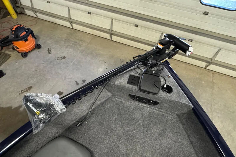 Slide: The Image of 2026 Tracker Pro Guide V-175 Combo boat interior with trolling motor and equipment. - 16