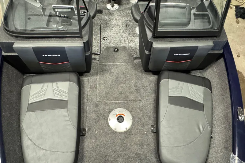 Slide: The Image of Interior of 2026 Tracker Pro Guide V-175 Combo boat with seating and carpeted floor. - 17