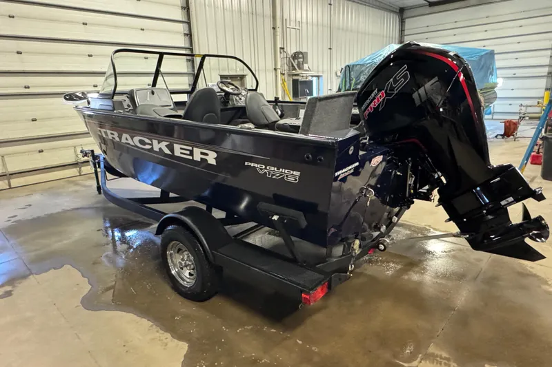 Slide: The Image of 2026 Tracker Pro Guide V-175 Combo boat in a garage setting. - 4