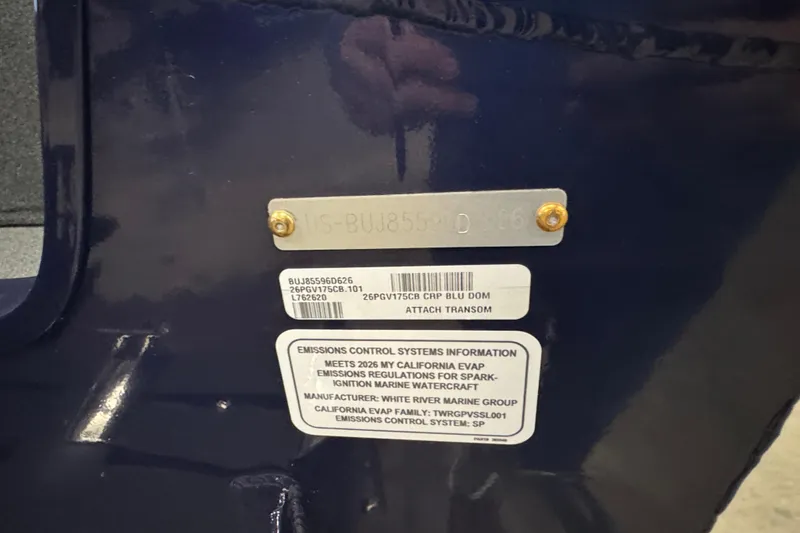 Slide: The Image of 2026 Tracker Pro Guide V-175 Combo emissions control label on blue surface. - 5