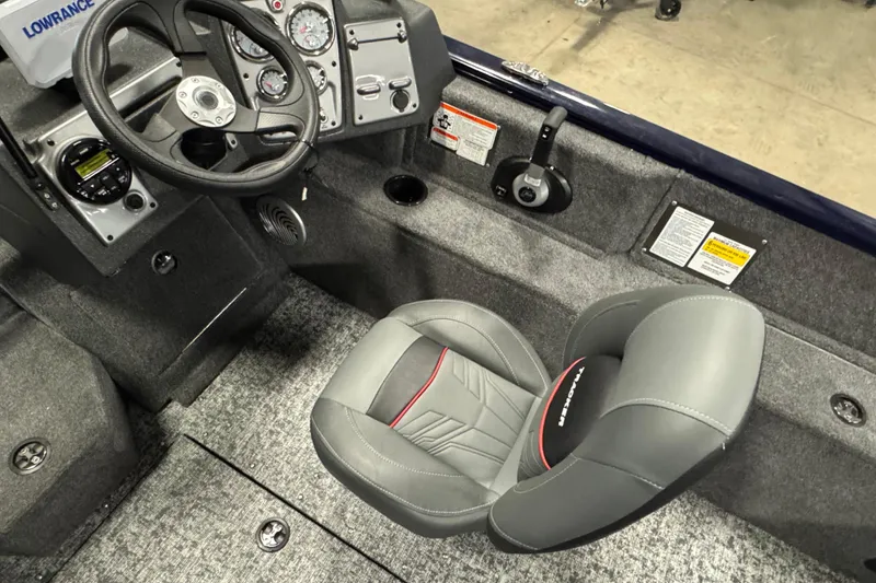 Slide: The Image of Interior of 2026 Tracker Pro Guide V-175 Combo boat with steering wheel and seat. - 6