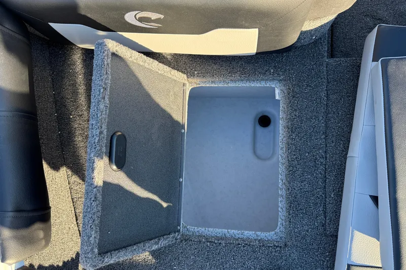 Slide: The Image of Open storage compartment in 2026 Crestliner 1850 Super Hawk boat interior. - 10