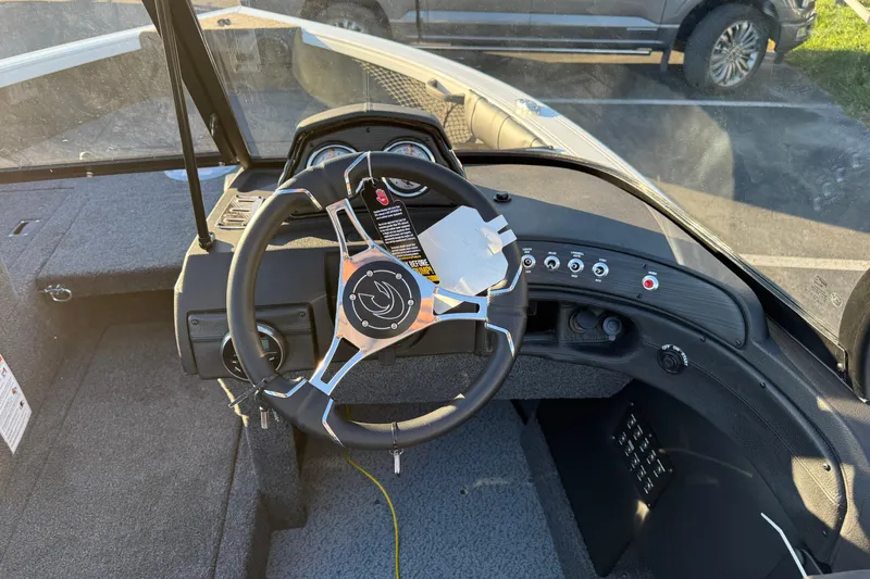 Slide: The Image of Steering wheel and dashboard of 2026 Crestliner 1850 Super Hawk boat. - 13