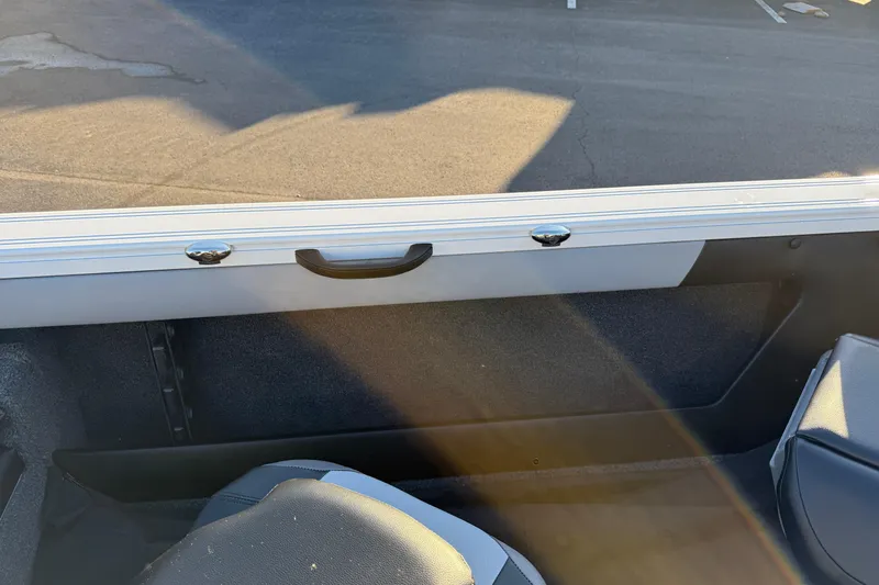 Slide: The Image of Interior view of 2026 Crestliner 1850 Super Hawk boat, featuring seating and storage. - 19