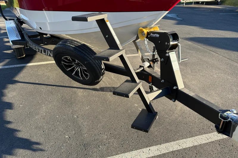 Slide: The Image of Trailer of 2026 Crestliner 1850 Super Hawk with steps and winch in parking lot. - 4