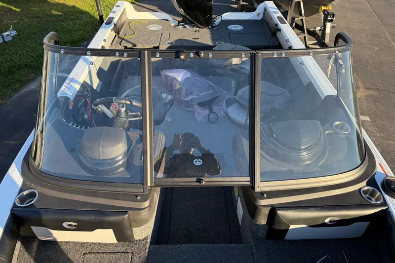 Slide: The Image of 2026 Crestliner 1850 Super Hawk boat interior with windshield and seating. - 8