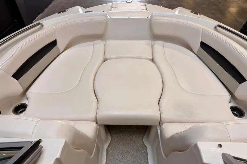 Slide: The Image of 2009 Chaparral Sunesta 224 Xtreme boat interior with white cushioned seating. - 12