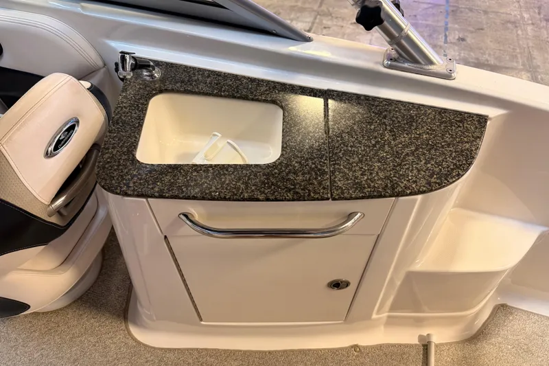 Slide: The Image of 2009 Chaparral Sunesta 224 Xtreme boat interior with sink and countertop. - 7