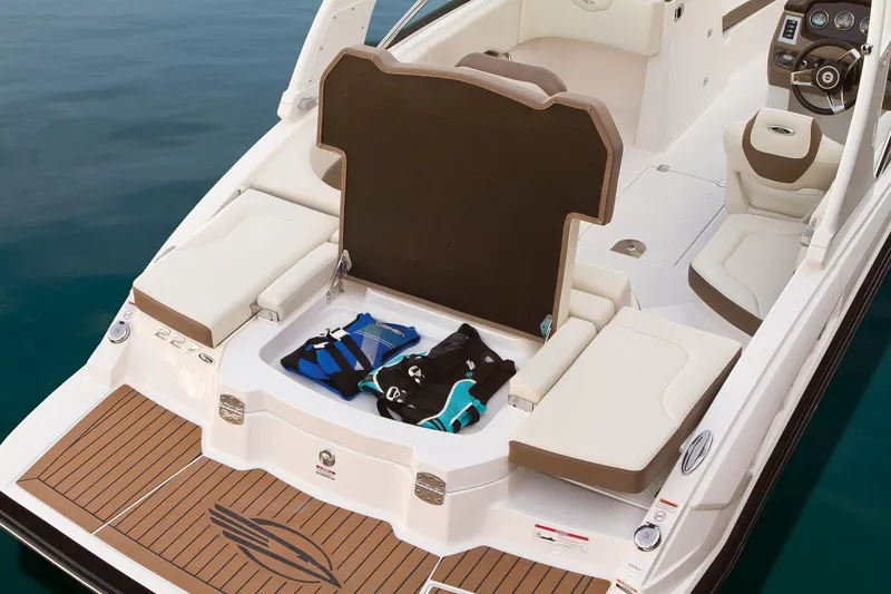 Slide: The Image of Manufacturer Provided Image: 2017 Chaparral 227 SSX boat with open storage compartment and life jackets. - 13