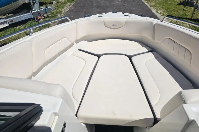 Slide: The Image of 2017 Chaparral 227 SSX boat interior with white cushioned seating. - 16