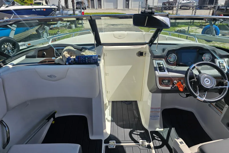 Slide: The Image of Interior view of 2017 Chaparral 227 SSX boat cockpit with steering wheel and dashboard. - 20