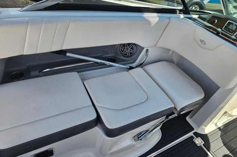 Slide: The Image of 2017 Chaparral 227 SSX boat interior with white seating and speaker system. - 23
