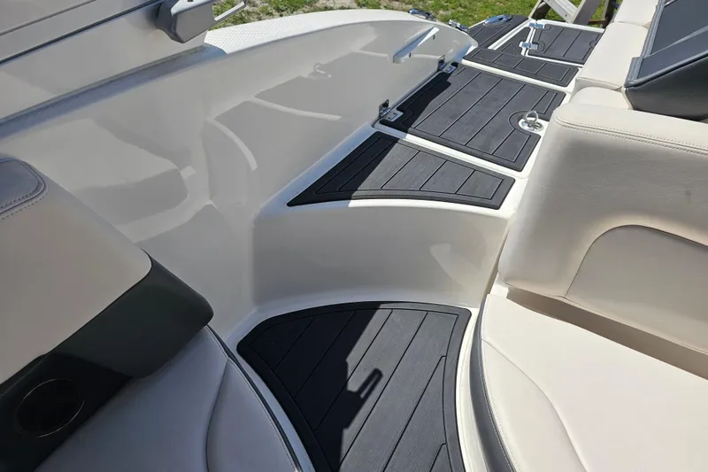 Slide: The Image of 2017 Chaparral 227 SSX boat interior with sleek seating and non-slip flooring. - 24