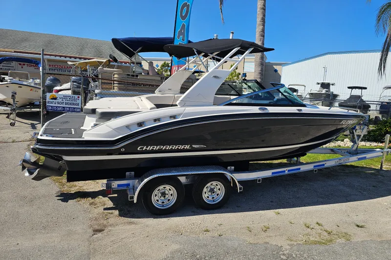 Slide: The Image of 2017 Chaparral 227 SSX boat on trailer, displayed outdoors at a dealership. - 4