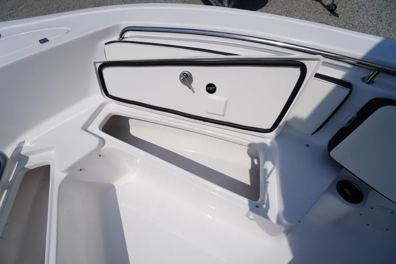 Slide: The Image of 2026 Tidewater 198 CC Adventure boat storage compartment with open hatch. - 14