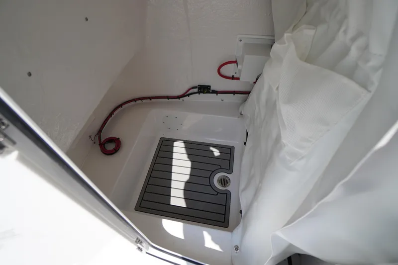 Slide: The Image of Interior of 2026 Tidewater 198 CC Adventure boat, featuring storage space and wiring. - 20