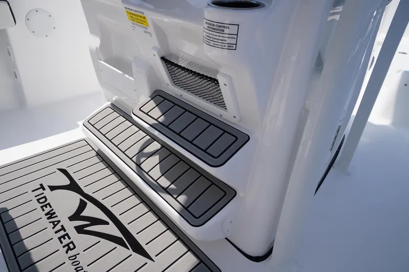 Slide: The Image of 2026 Tidewater 198 CC Adventure boat interior steps and logo detail. - 24