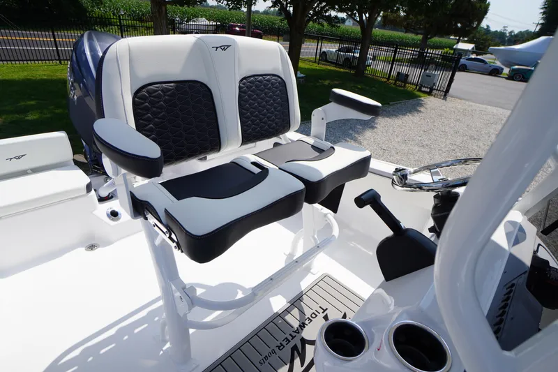 Slide: The Image of 2026 Tidewater 198 CC Adventure boat seating and helm, featuring modern design and comfort. - 27