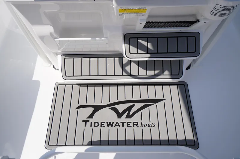 Slide: The Image of 2026 Tidewater 198 CC Adventure boat deck with logo and non-slip surface. - 29