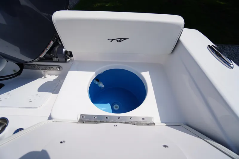 Slide: The Image of 2026 Tidewater 198 CC Adventure boat livewell with blue interior. - 38