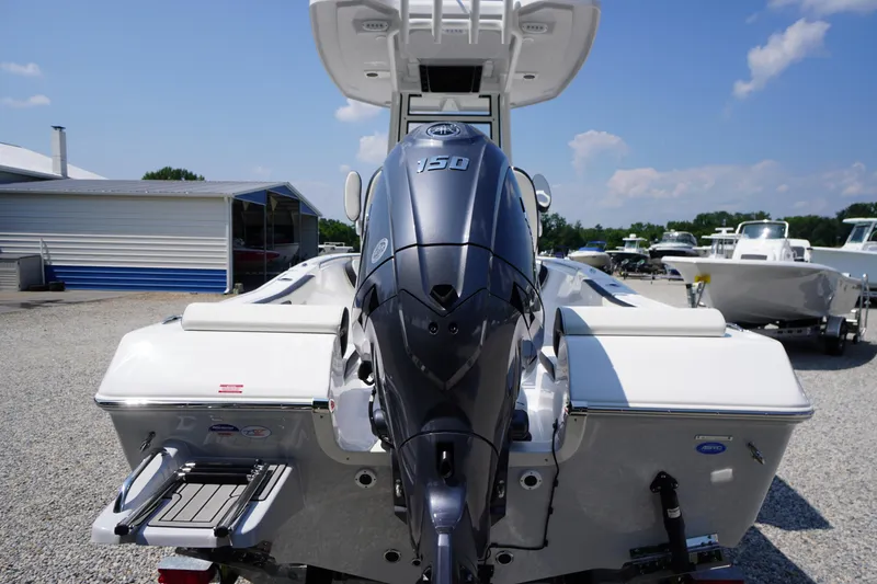 Slide: The Image of 2026 Tidewater 198 CC Adventure boat with powerful outboard motor, displayed outdoors. - 46