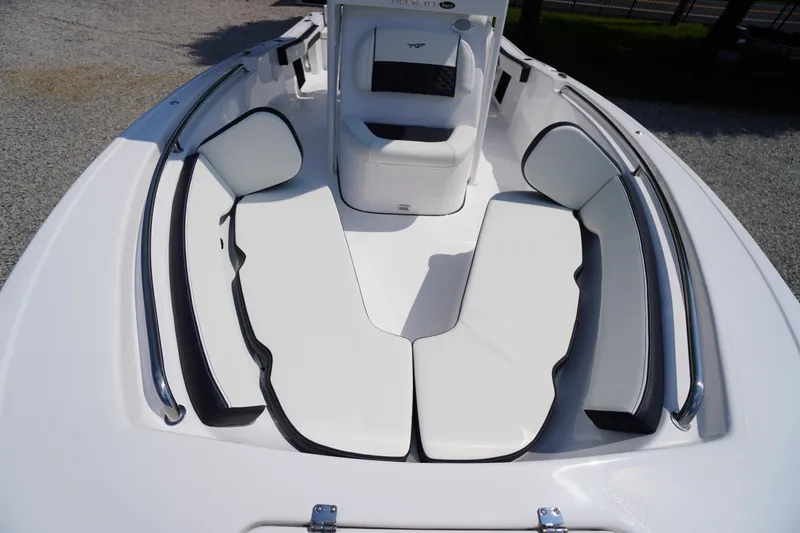 Slide: The Image of 2026 Tidewater 198 CC Adventure boat with white cushioned seating and sleek design. - 8