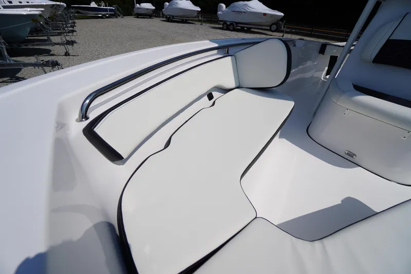 Slide: The Image of 2026 Tidewater 198 CC Adventure boat interior with white cushioned seating and sleek design. - 9