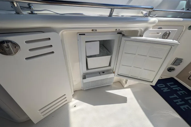 Slide: The Image of Open storage compartment on a 2001 Sea Ray 410 Sundancer boat deck. - 10