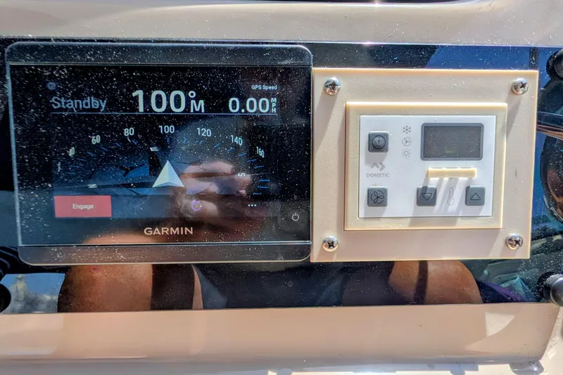 Slide: The Image of Garmin navigation display and Dometic control panel on 2001 Sea Ray 410 Sundancer - 8