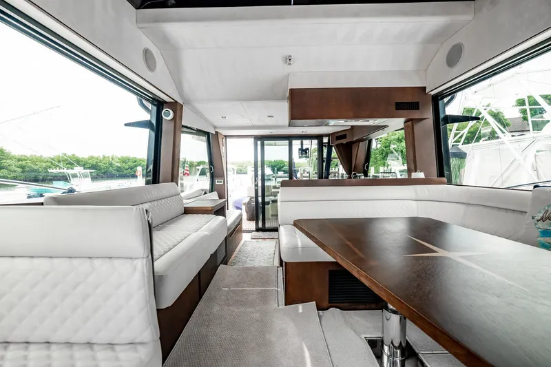 Slide: The Image of Luxurious interior of 2017 Galeon 510 Sky yacht with elegant seating and dining area. - 7
