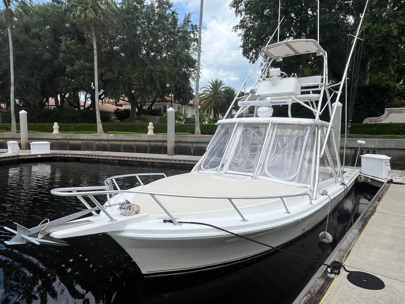 The Image of 2005 Strike 35 Sportfisherman boat docked, featuring sleek design and spacious deck. - 2