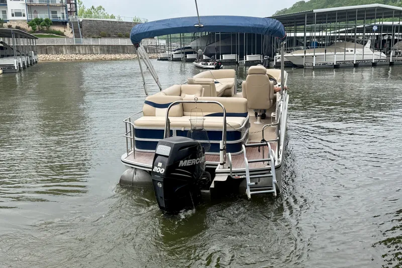 Slide: The Image of 2013 Harris Solstice 240 pontoon boat with blue canopy and Mercury 200 outboard motor. - 5