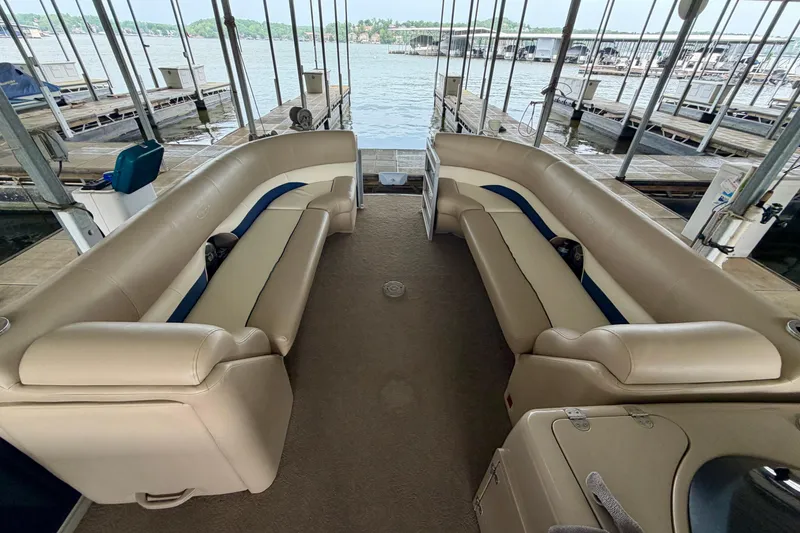 Slide: The Image of Interior of a 2013 Harris Solstice 240 pontoon boat with beige seating. - 8