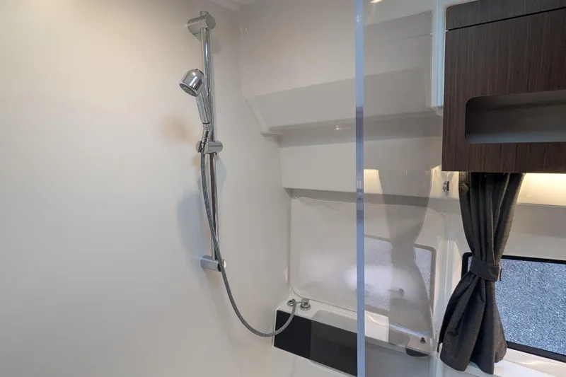 Slide: The Image of Shower area in 2024 Beneteau Antares 11 Fly boat, featuring modern fixtures and sleek design. - 18